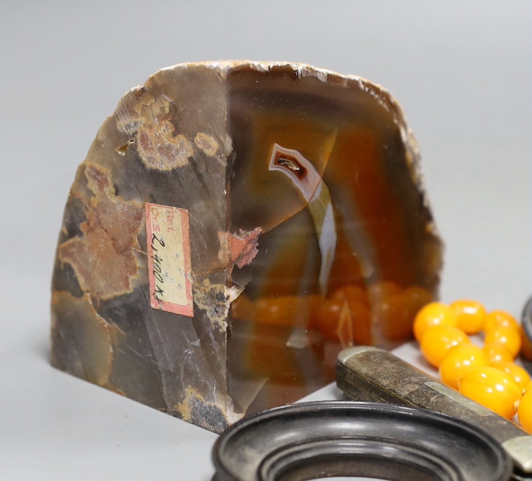 Mixed collectables including a pair of agate bookends, a mother of pearl handled silver fruit knife, faux amber necklace, hardwood stands etc.